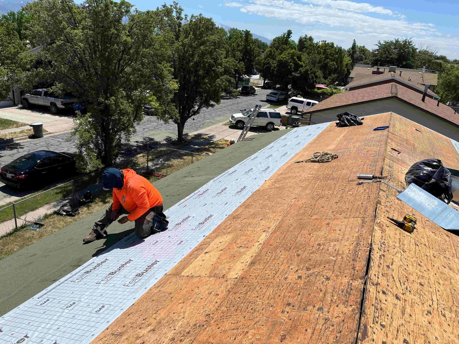 Professional roofer leaning on a white railing
